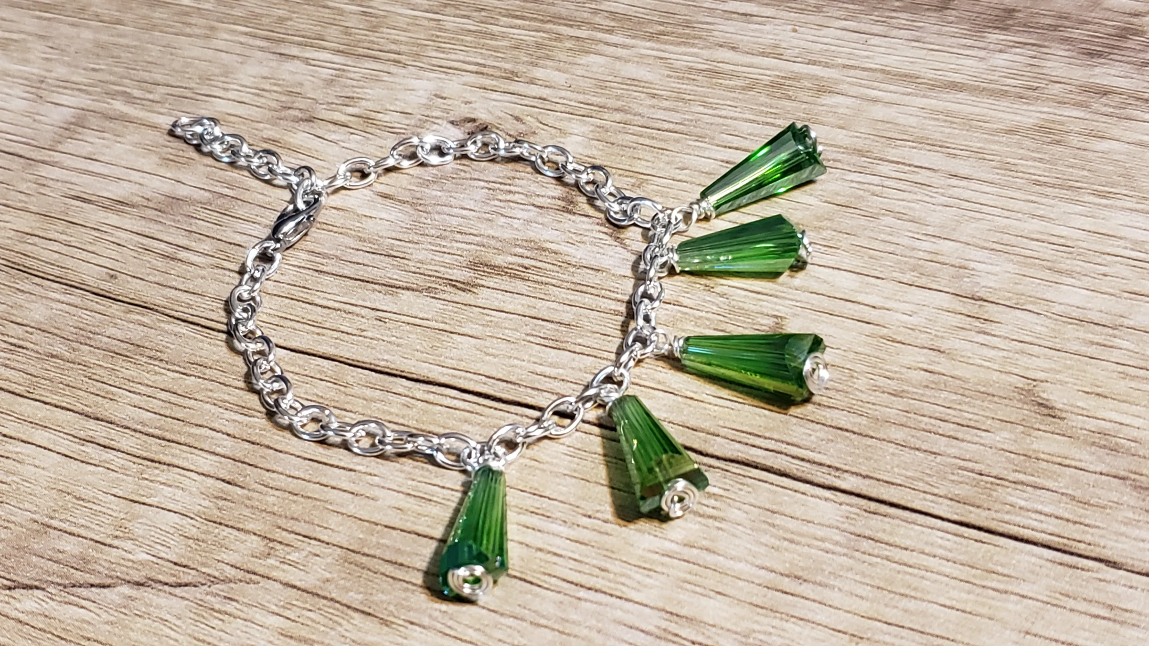 Silver Plated Chain Bracelet with Aurora Borealis finished Green Czech Glass. Hand Crafted, Adjustable with Lobster Claw Clasp
 