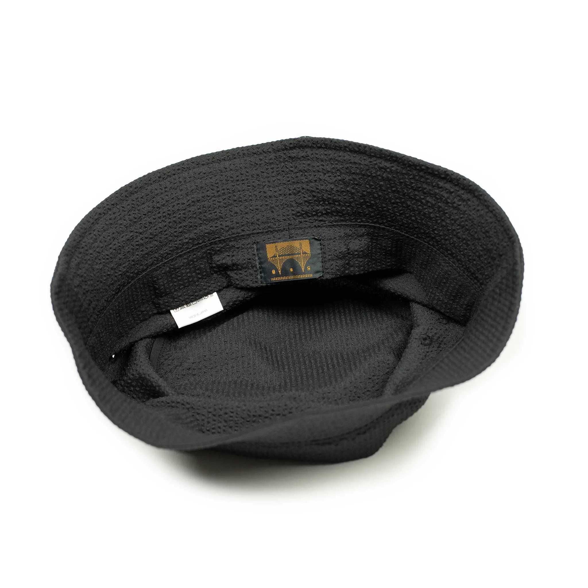 Storage loop bucket hat in tonal black CoolMax seersucker