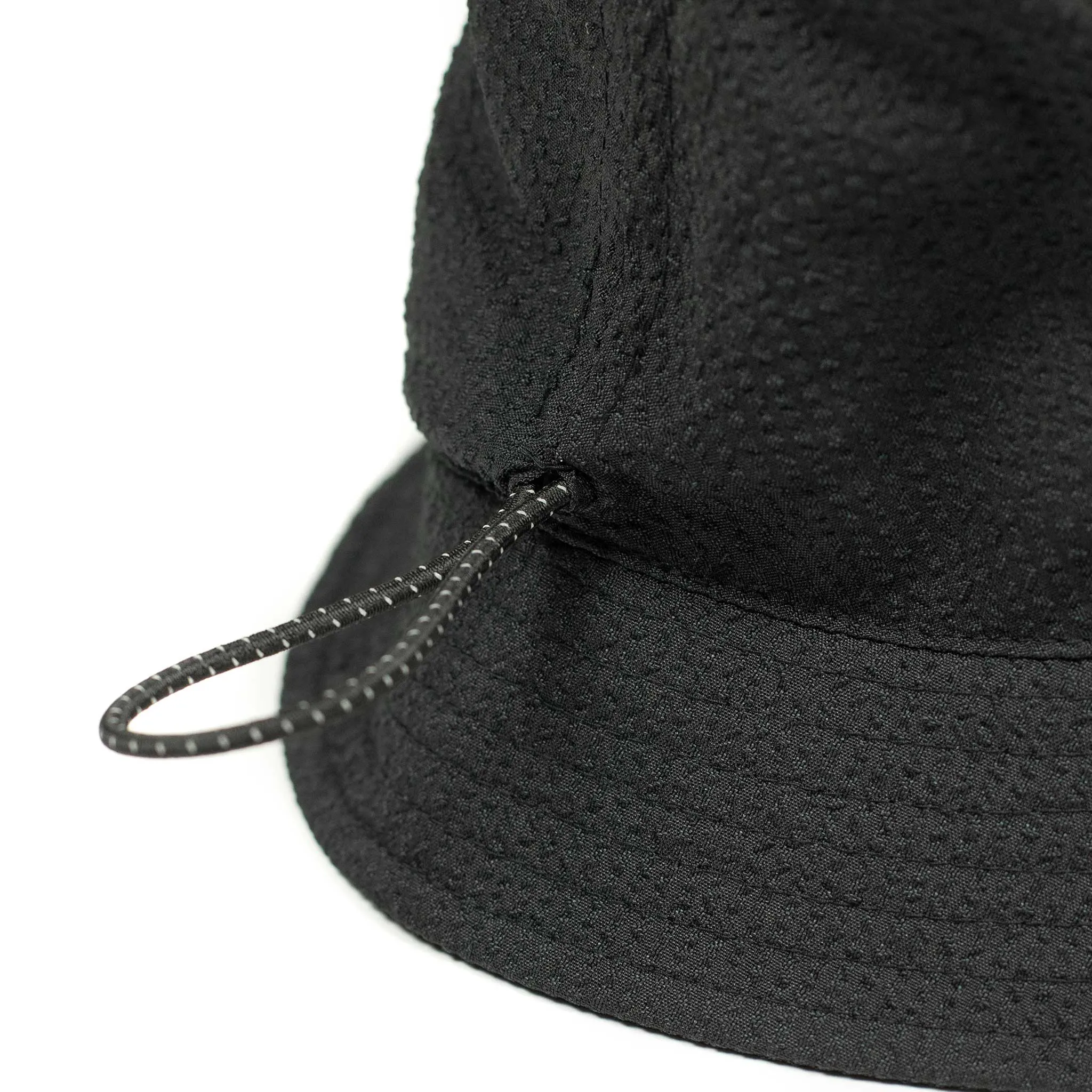 Storage loop bucket hat in tonal black CoolMax seersucker